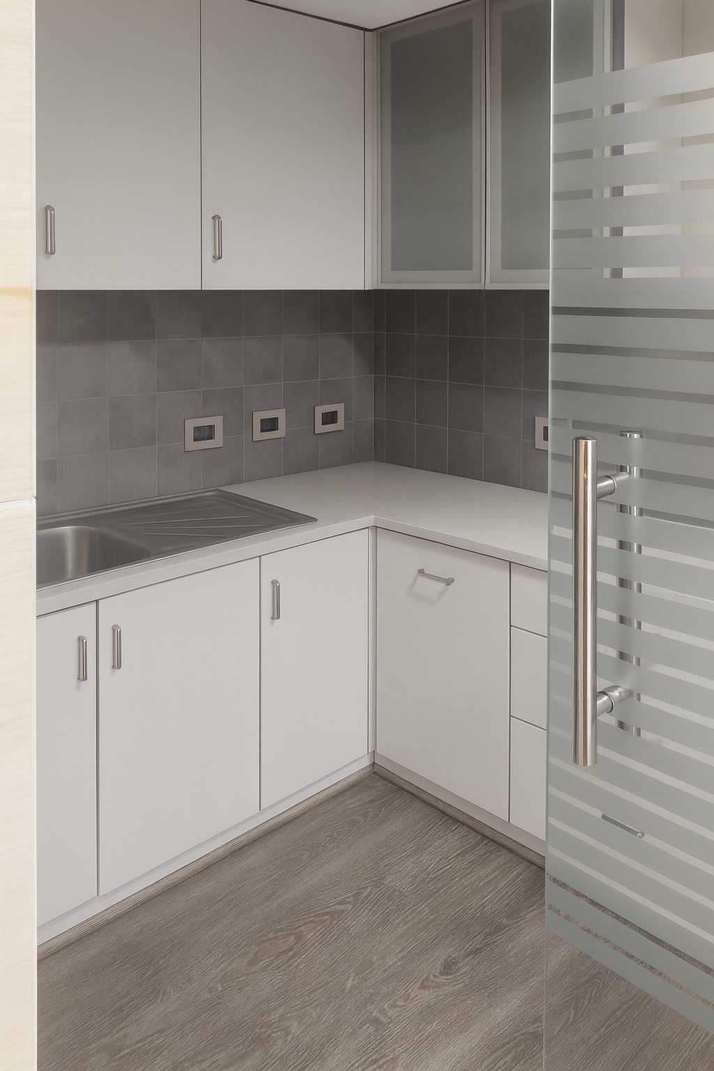 Fitted L-shaped kitchen and pantry area with modern cabinetry at Le Meridien 7th floor office